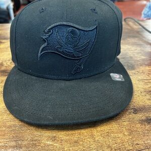 New Era Tampa Bay Buccaneers Black on Black 9FIFTY Snapback Hat.